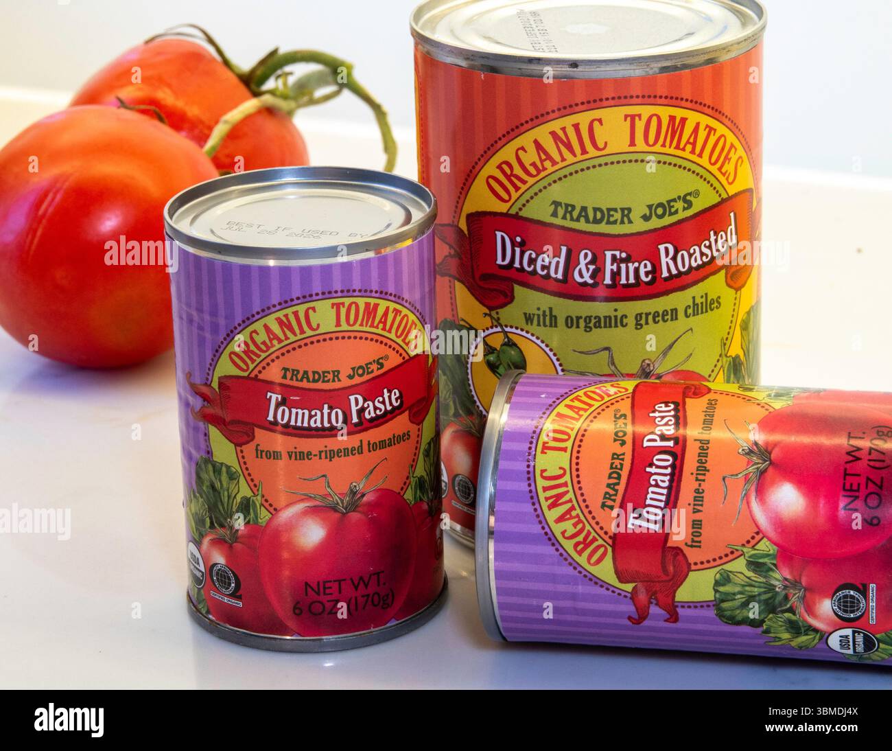 Trader Joe's grocery store sells a full line of canned  tomato products, 2025, United States Stock Photo
