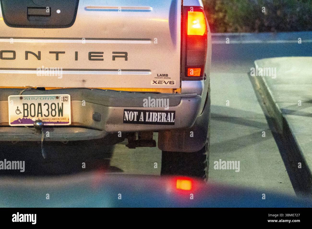 A rugged frontier truck that has a bumper sticker stating it is not a liberal Stock Photo