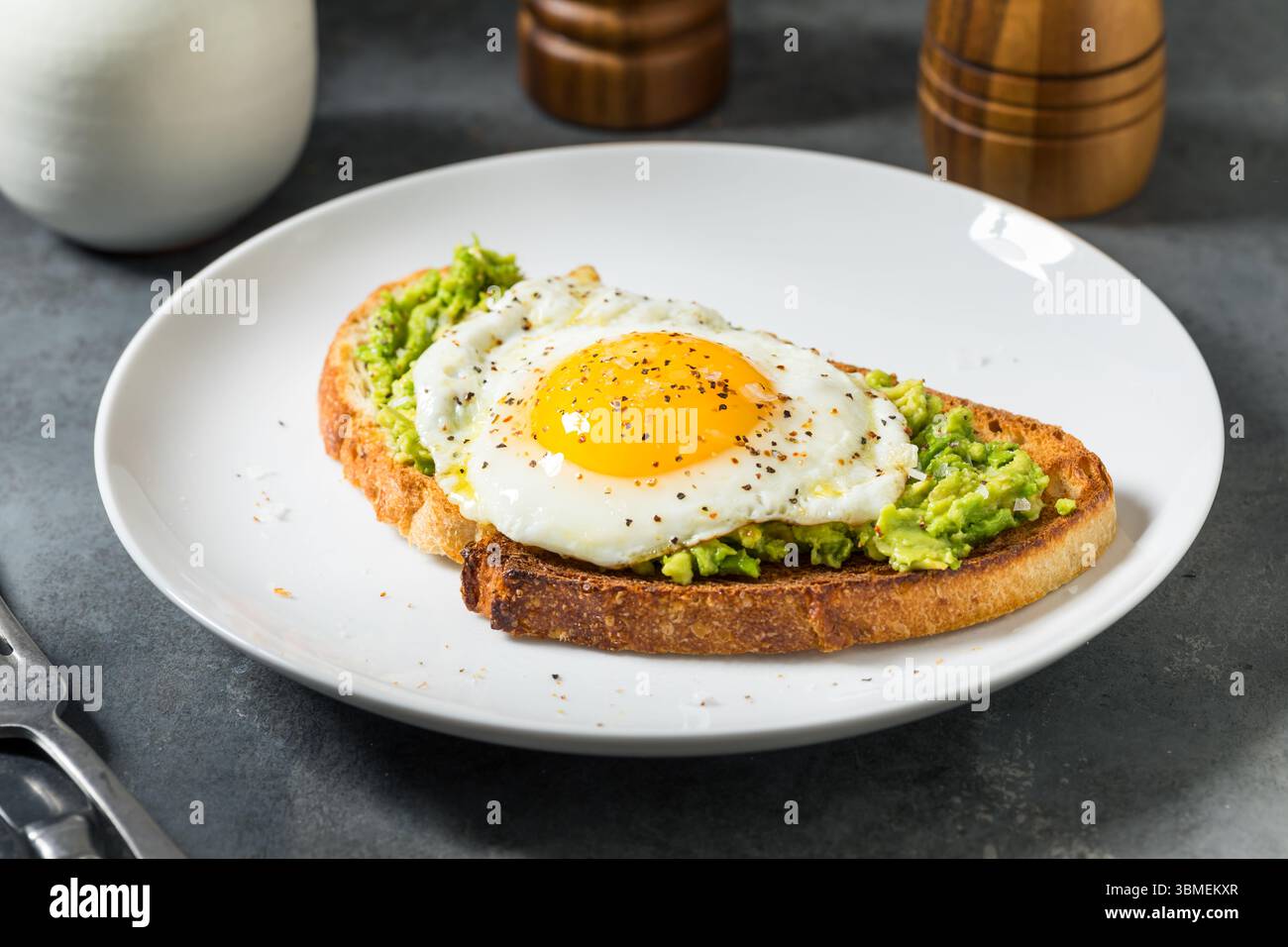 Healthy Homemade Avocado Toast with Over Easy Egg for Breakfast Stock Photo