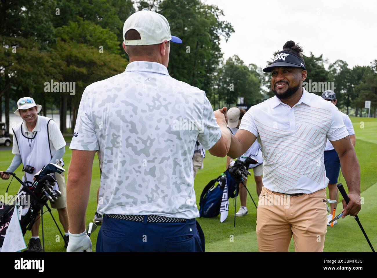 Jason Kokrak of Smash GC fist bumps with am-am participant during the ...