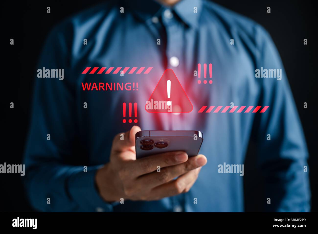 Cybersecurity warning alert on smartphone with red triangle Stock Photo
