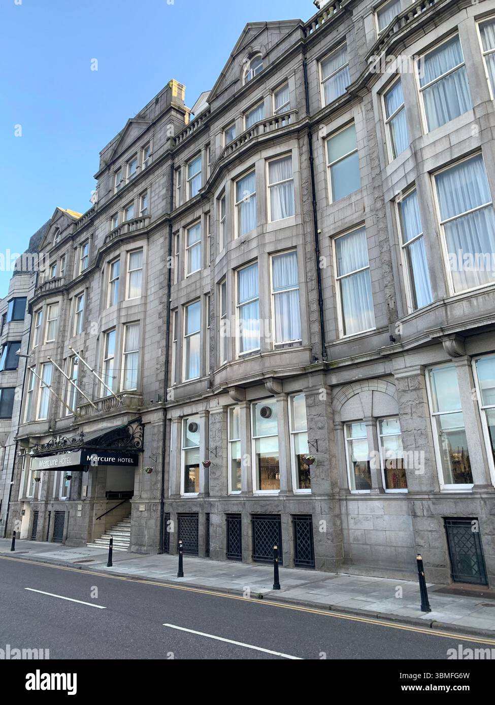 Aberdeen Scotland City Centre gardens garden Park sign signs grass tower building new style ornament Hotel stained glass window  walking people - Smartphone Captured Stock Image
