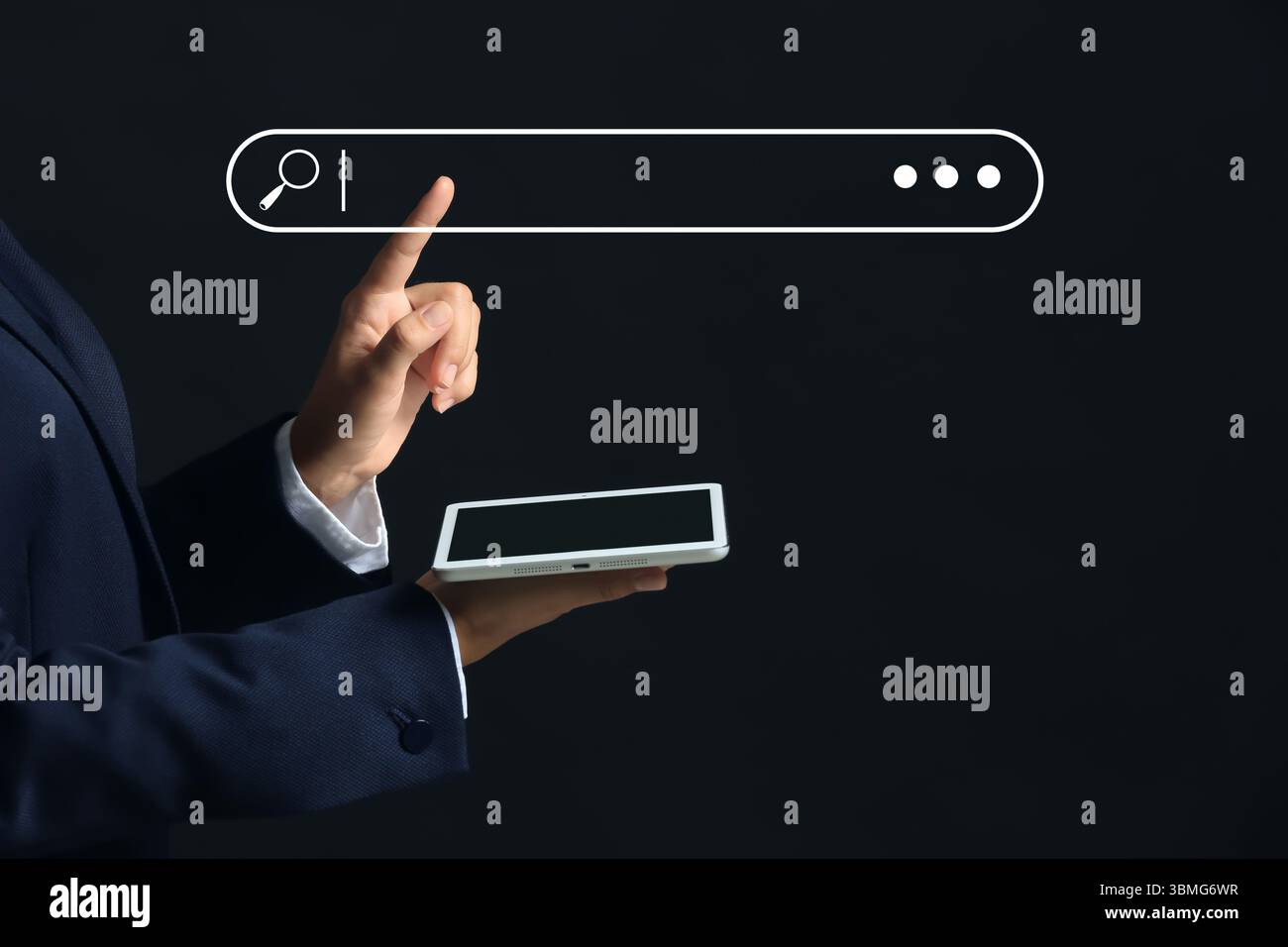 Businessman with tablet computer using web search engine on dark background Stock Photo