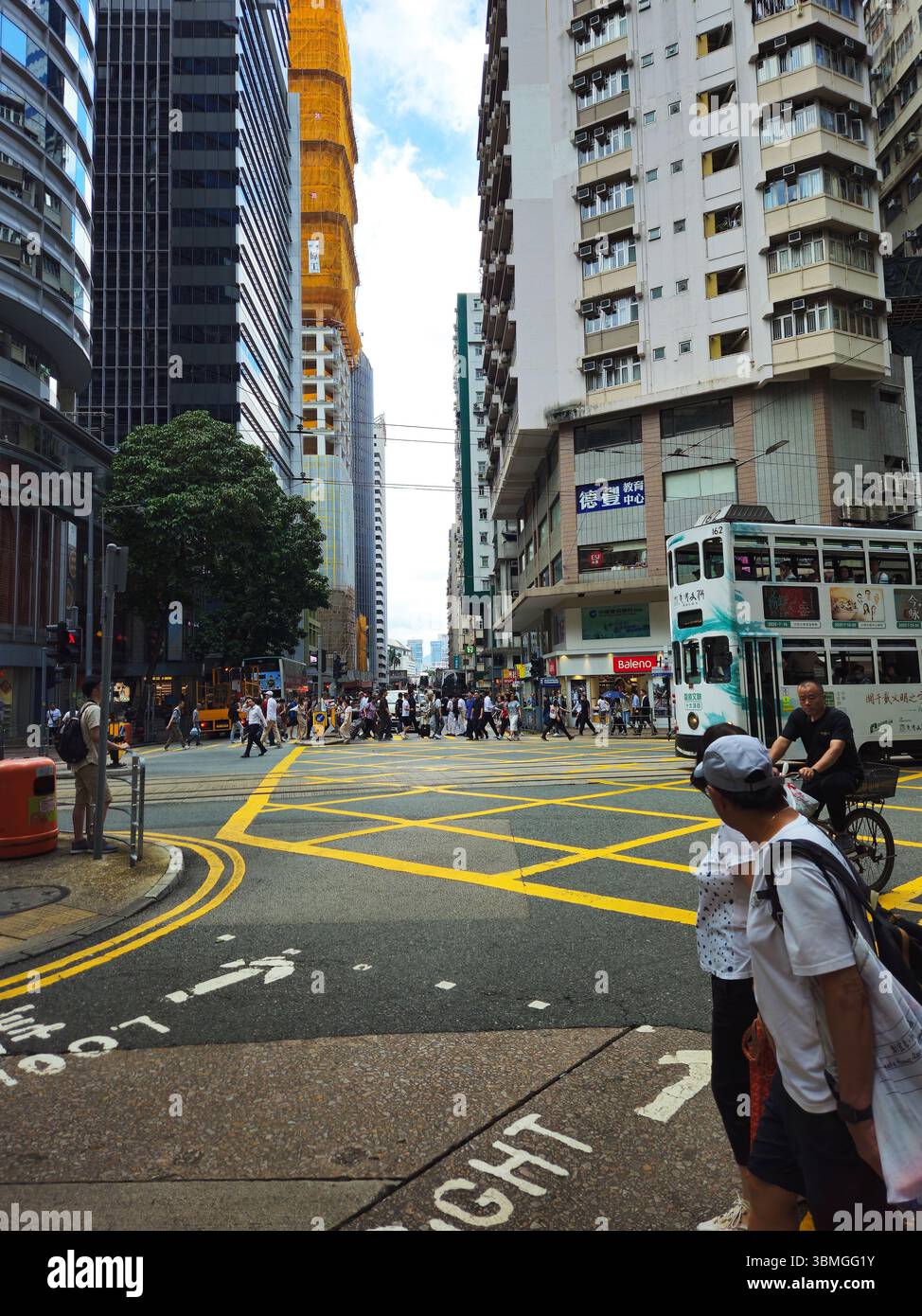Busy Wan Chai Intersection with Double-Decker Tram Stock Photo - Alamy