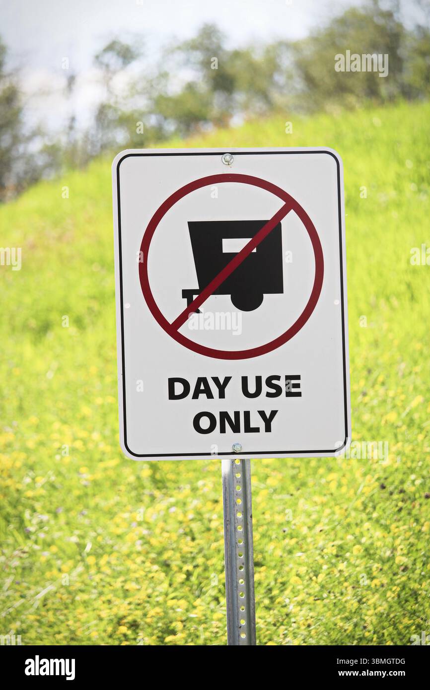 Closeup of a day use only sign Stock Photo - Alamy