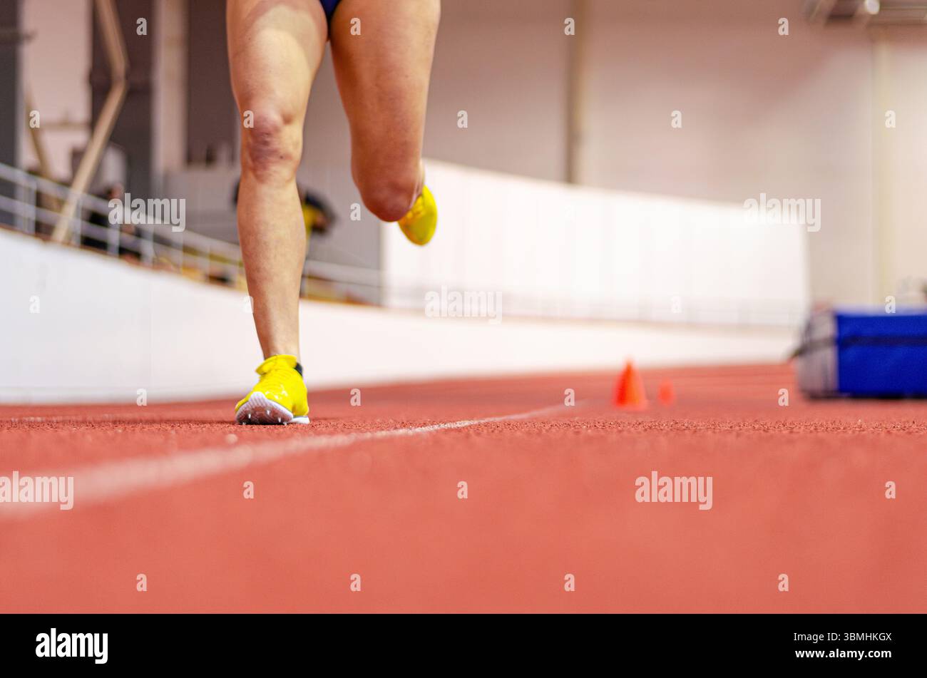 Dynamic detail of sprinter’s feet hitting the track in lightweight ...