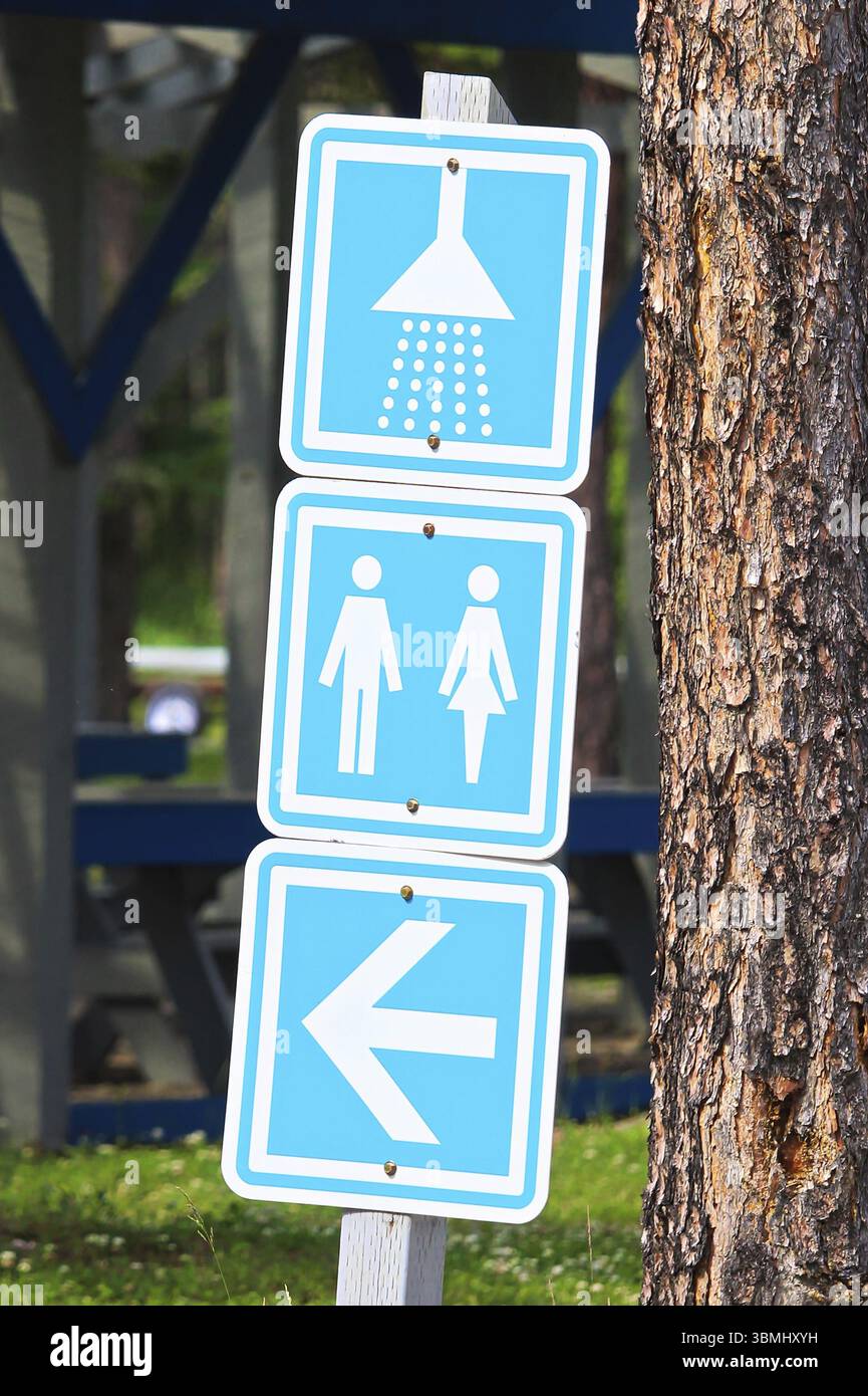A showers and washroom directions sign at a campground Stock Photo - Alamy