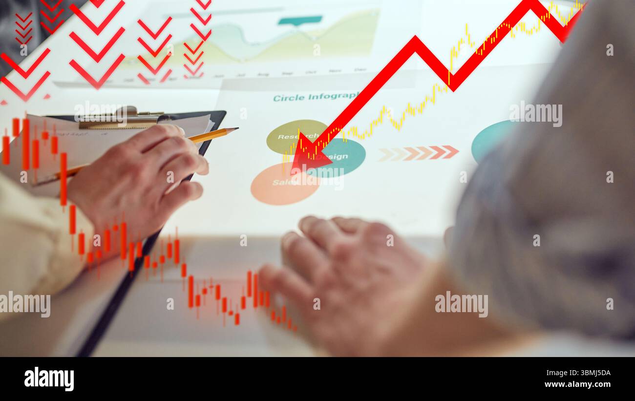 Hands analyze sales chart as red graph plummets downward. Economic ...
