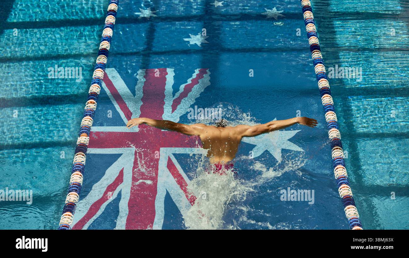 Professional swimmer gliding over Australian flag in competition pool ...