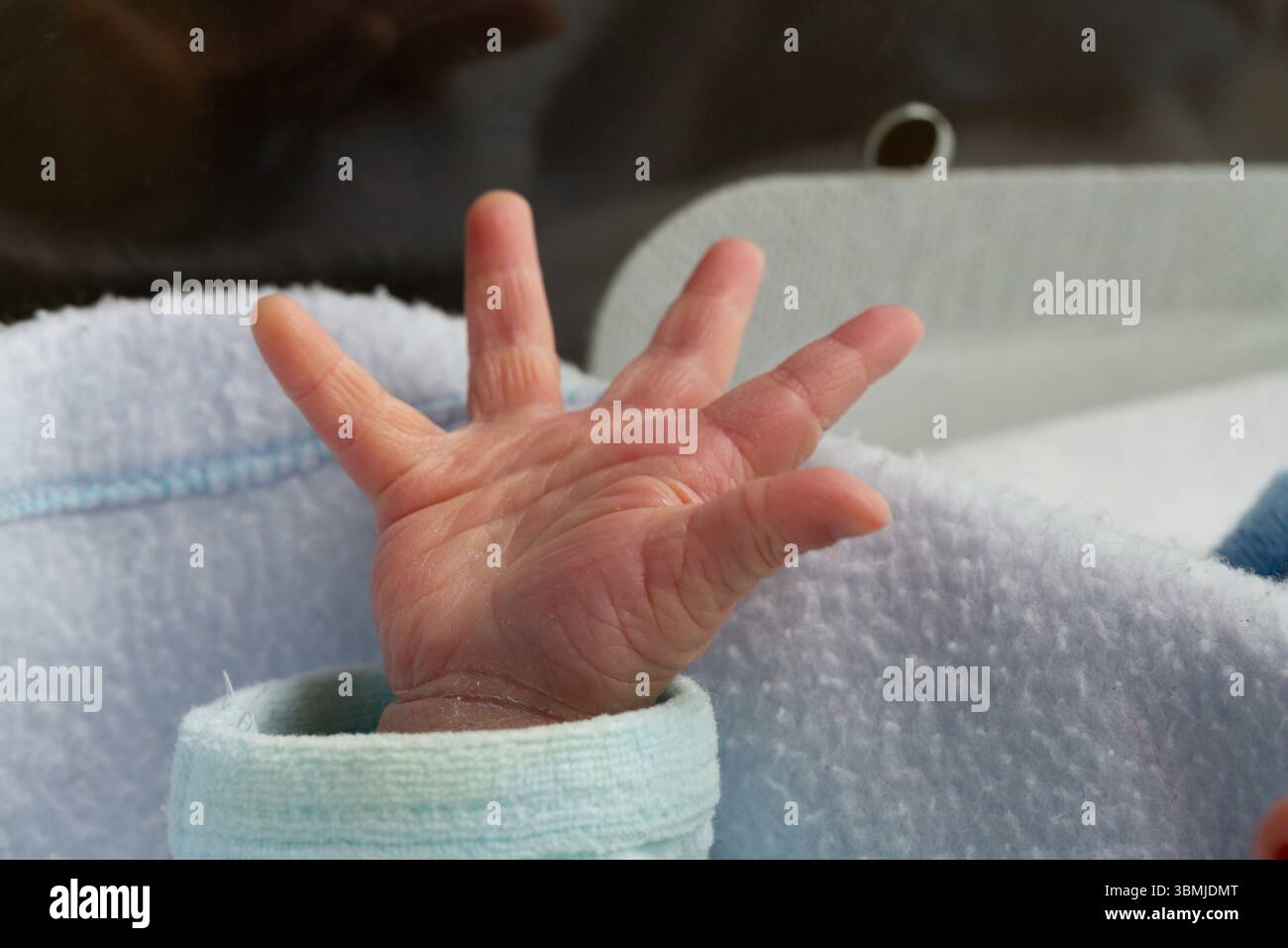 Baby reaching out tiny fingers hi-res stock photography and images - Alamy