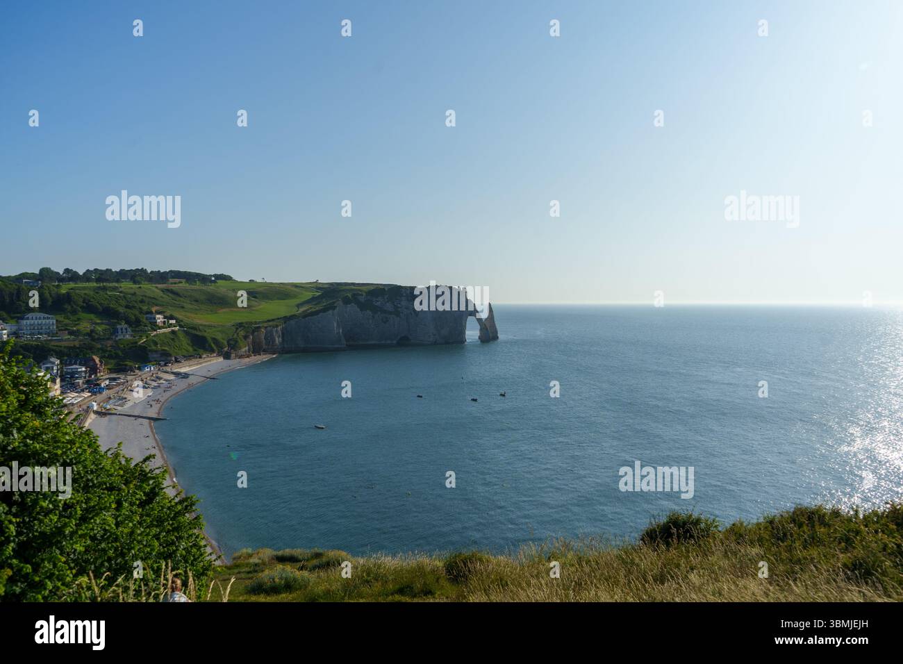 The dramatic white chalk cliffs and natural arches of Étretat on the ...