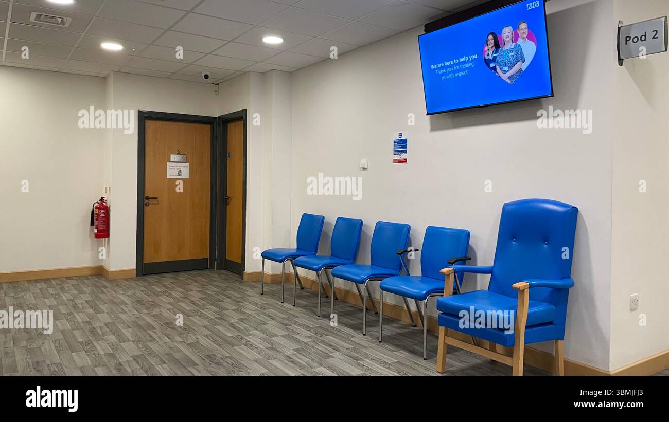 As NHS waiting lists in England show a decrease to a  two year low, the waiting rooms of GPs start to display that improvement - Smartphone Captured Stock Image
