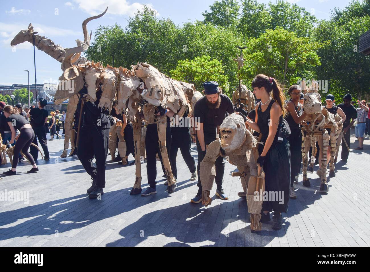 London, UK. 27th June 2025. Puppeteers take life-size animal puppets ...