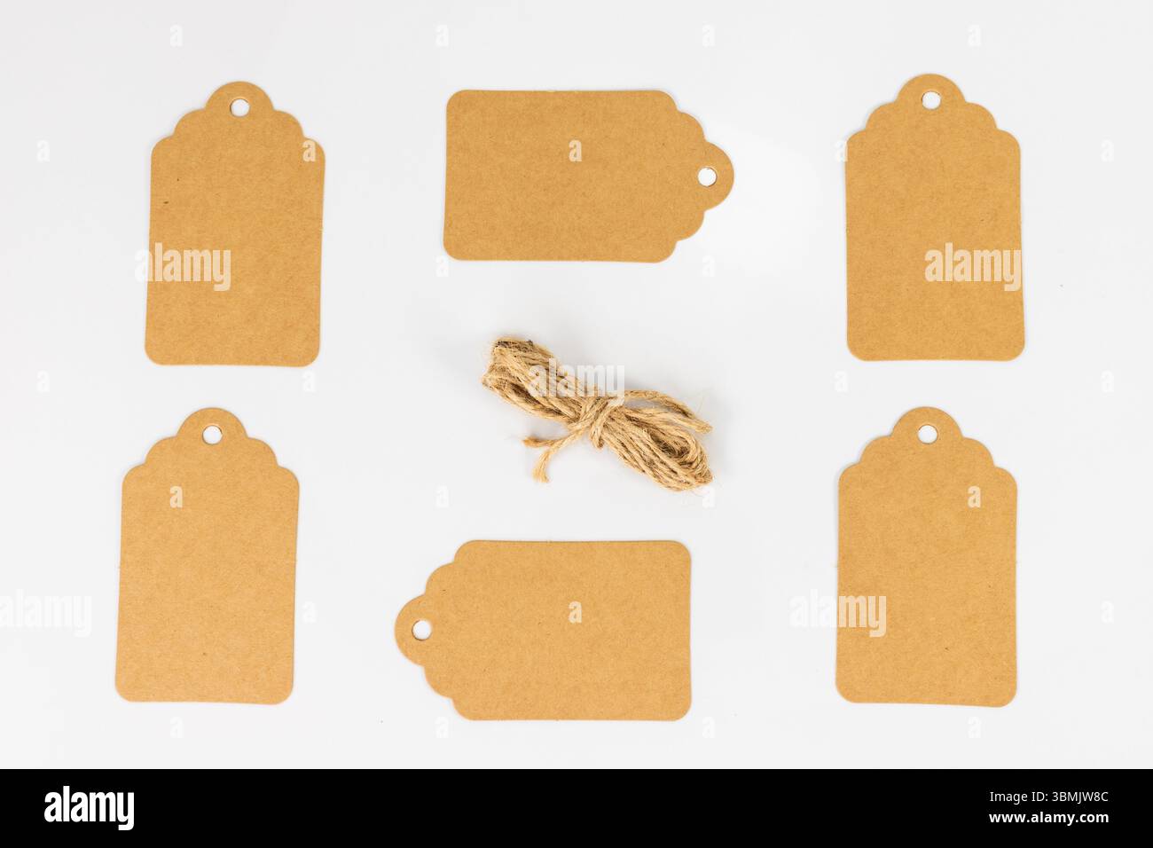 A Set of Brown Tags with Jute String on White Isolated Background Stock Photo