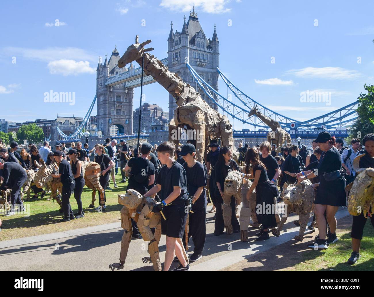 Puppetees Puppeteers take life-size animal puppets for a walk near Tower Bridge ...