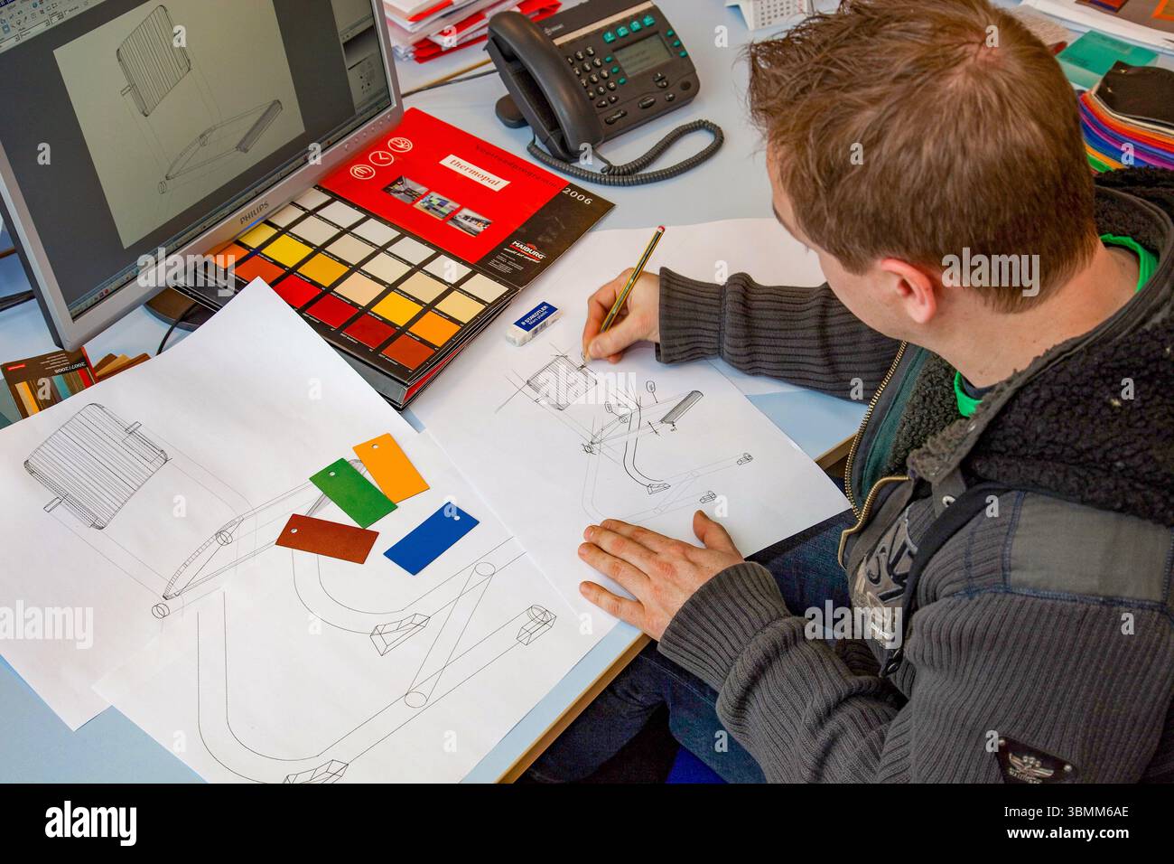 Netherlands, an industrial designer or product designer works on both the design and the color of a new chair. Stock Photo