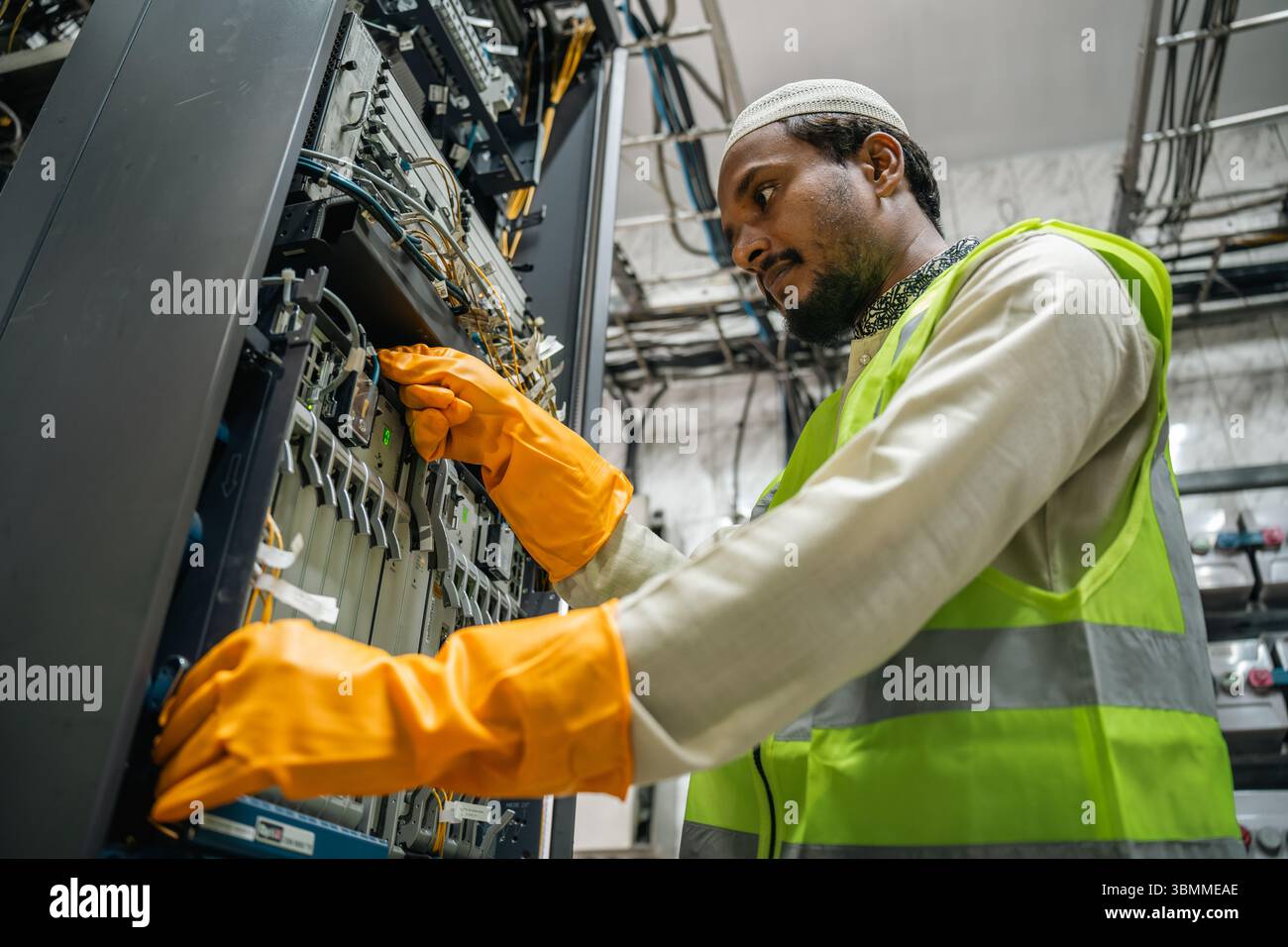 Technician and engineer team fixing network devices, routers ...