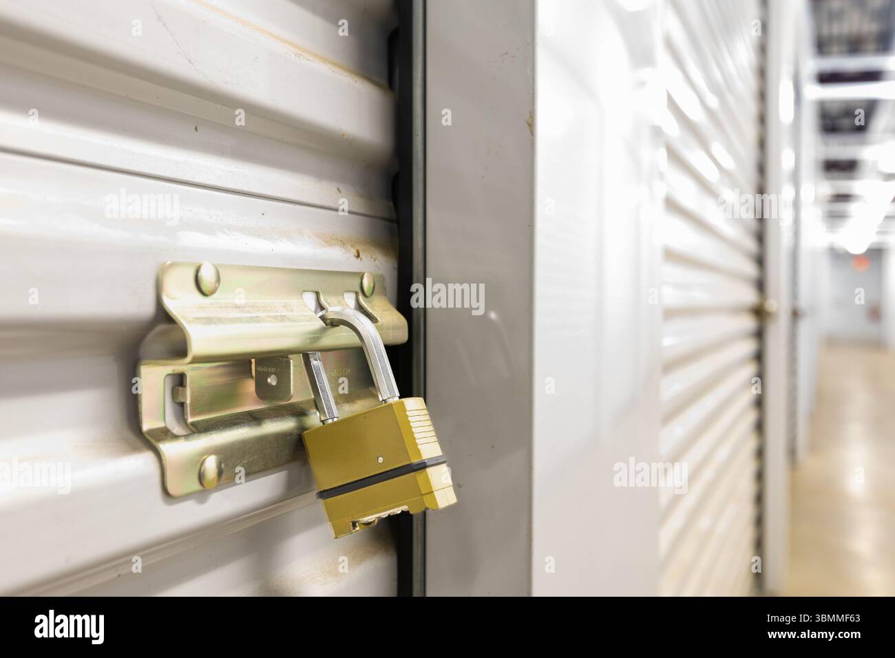 Combination lock on white self storage door Stock Photo