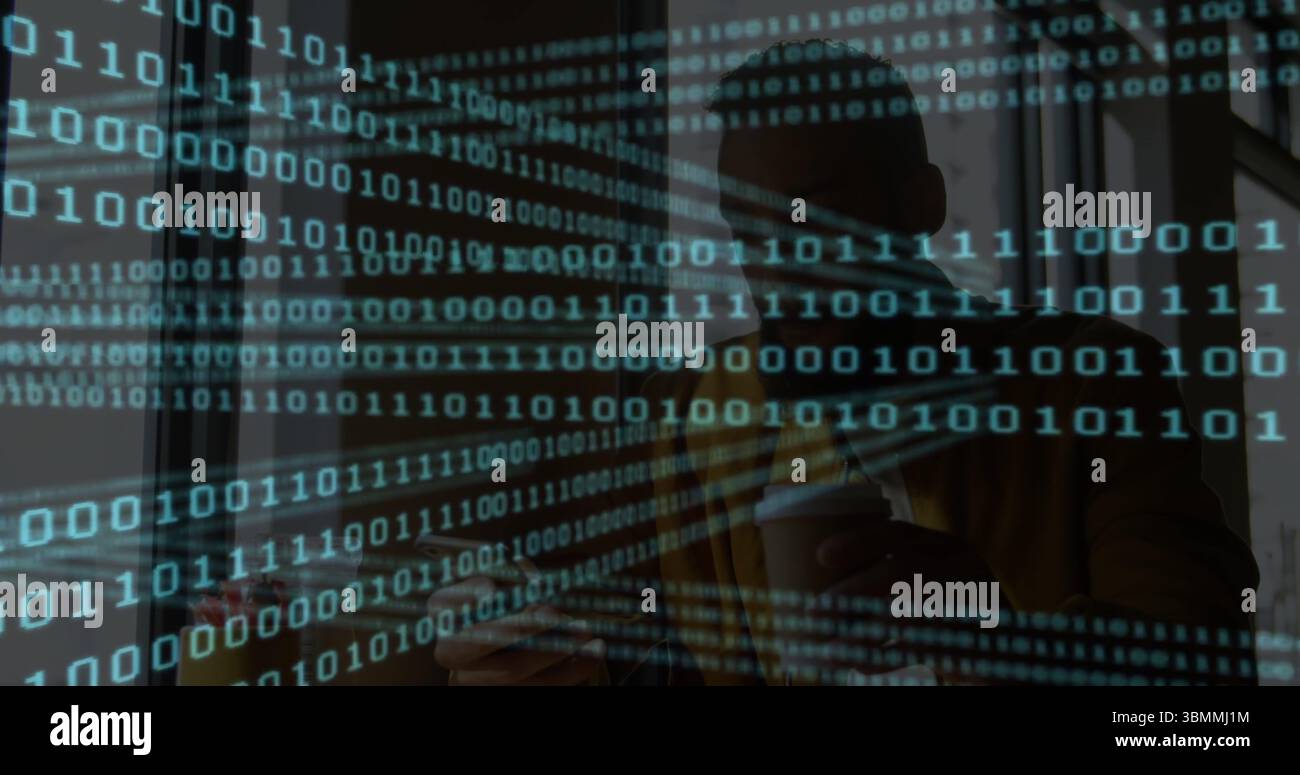 Man wearing fedora holding coffee cup, tapping smartphone in café with binary code on glass panel Stock Photo