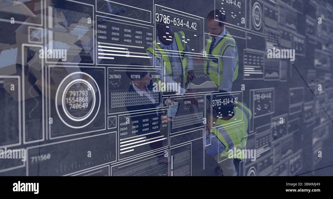 Analyzing digital data interfaces and graphs, engineers in safety vests working Stock Photo