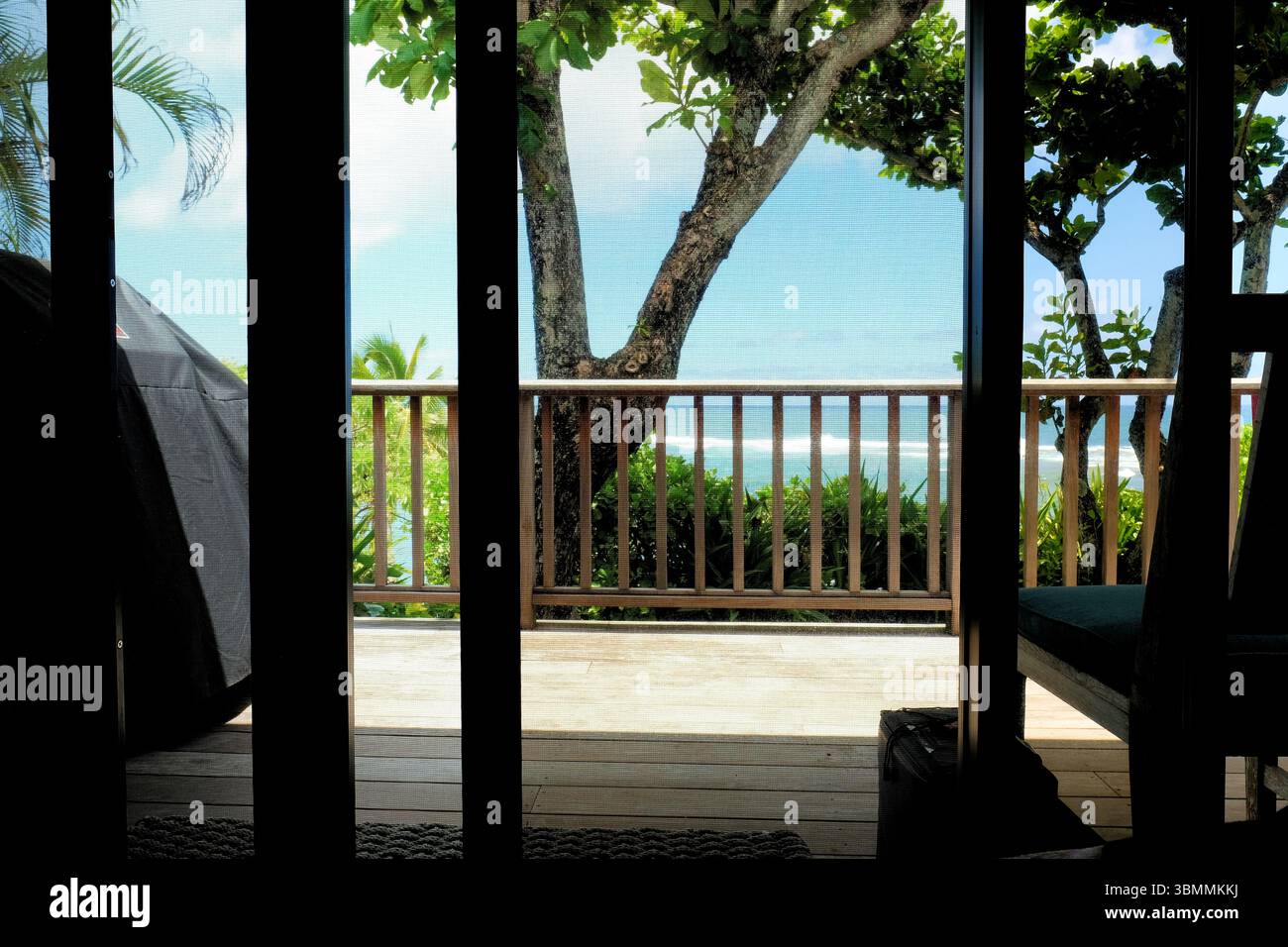 A view from inside a rental property in Hawaii looking out through a ...