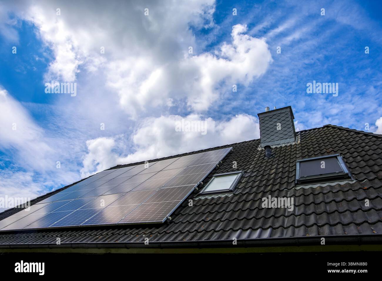 Photovoltaic panels are installed on a roof, harnessing solar energy ...