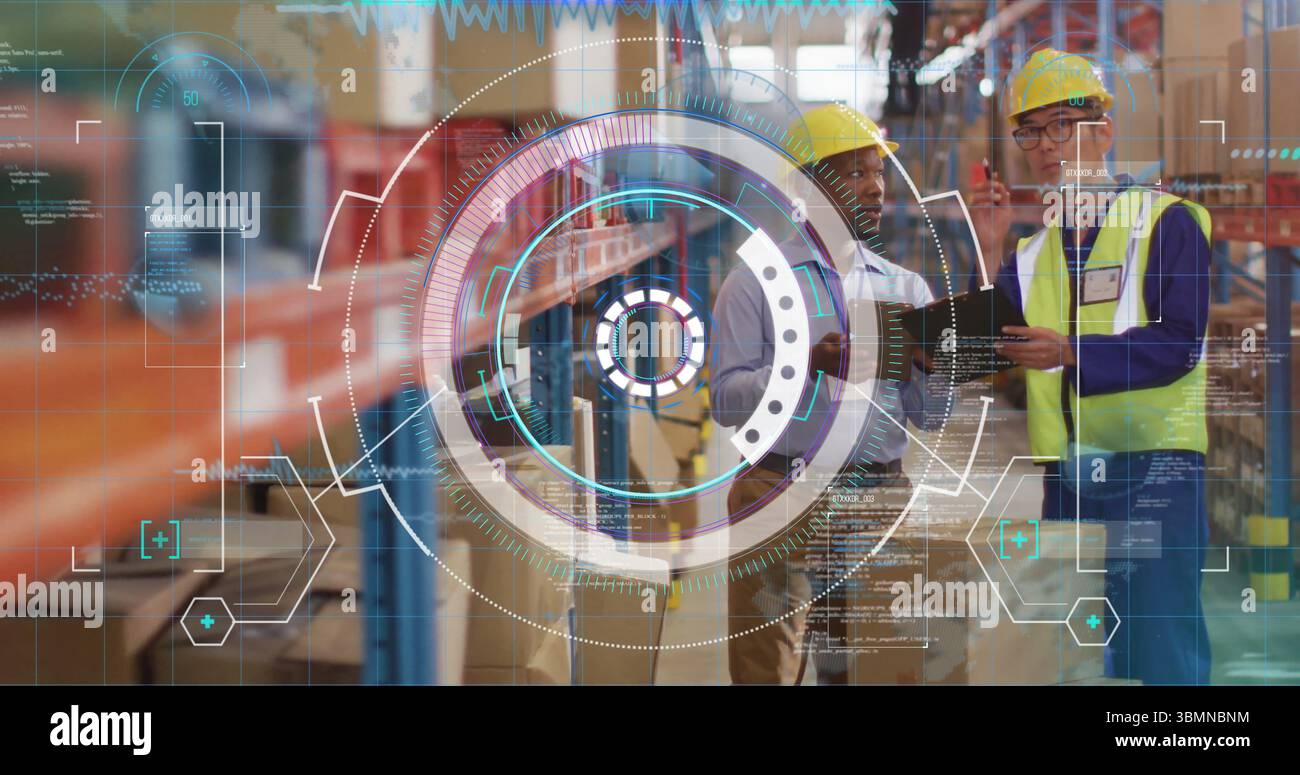 Checking inventory two workers in yellow hard hats using tablet on warehouse racks, copy space Stock Photo