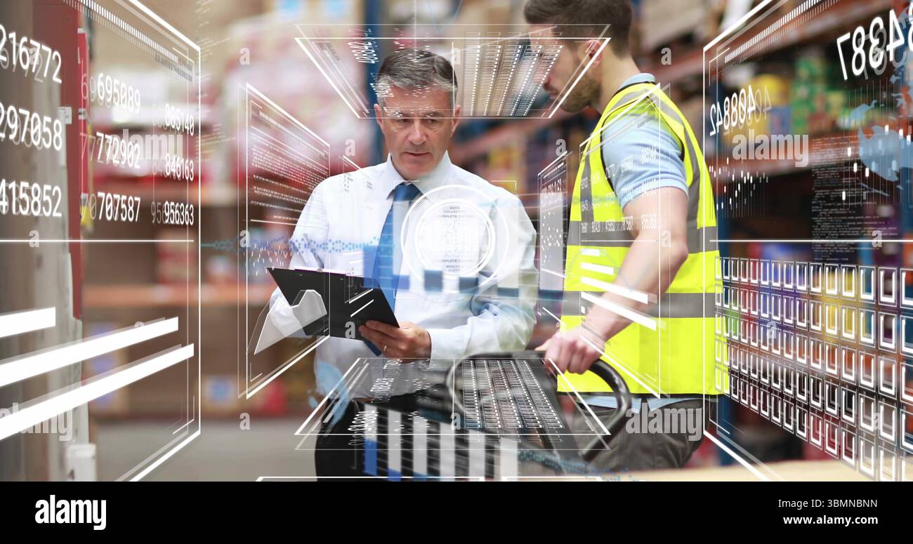 Reviewing digital overlay, tie-clad manager and vested worker using pallet jack in warehouse aisle Stock Photo