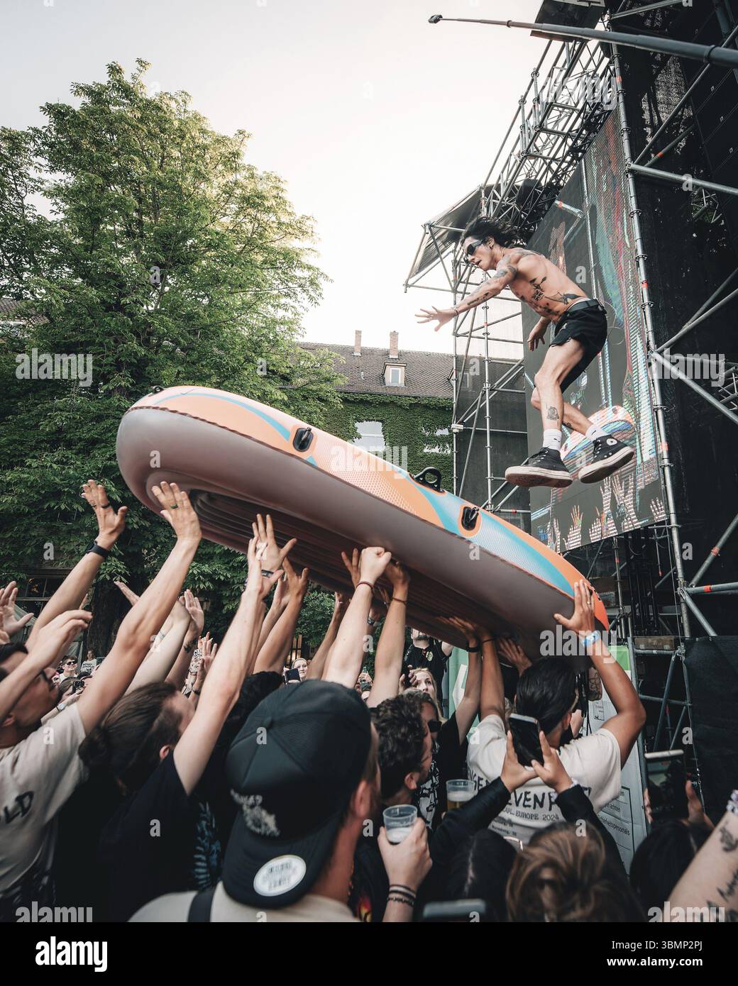 Remington Leith, singer of Palaye Royale jumps into an inflatable boat ...