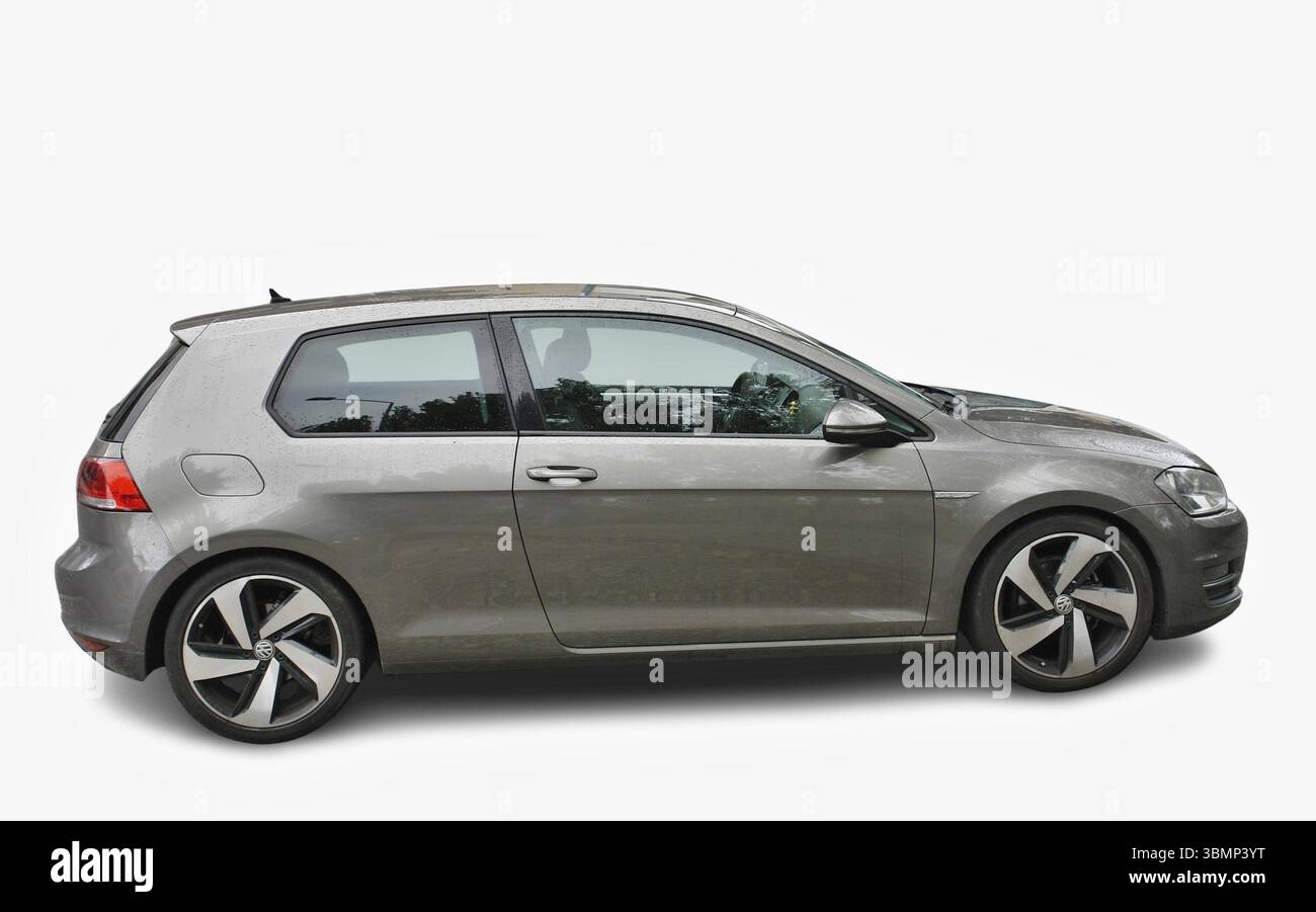Modern Volkswagen Golf VII car parked, showing left side view, isolated on white background Stock Photo