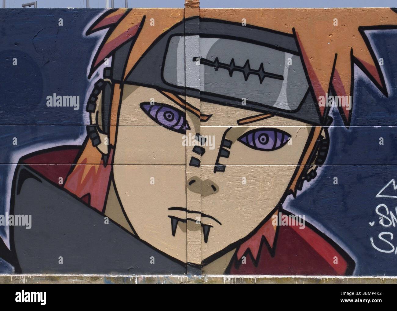 Close-up of a vibrant graffiti featuring Pain, a character from the popular anime series Naruto Shippuden, showcasing artistic expression Stock Photo