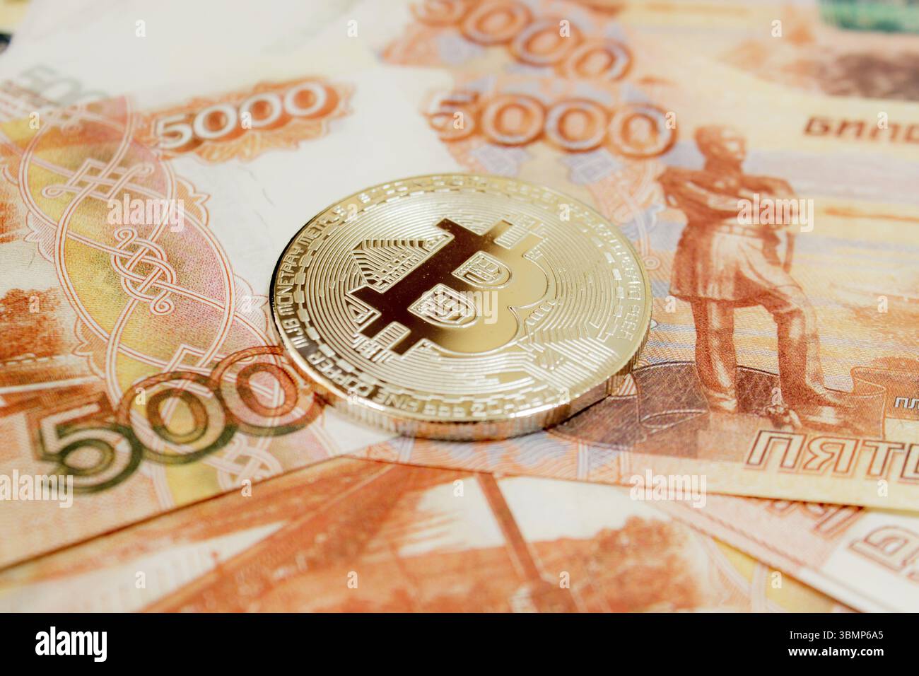 bitcoin cryptocurrency with russian rubles money, five thousand banknotes  closeup Stock Photo - Alamy