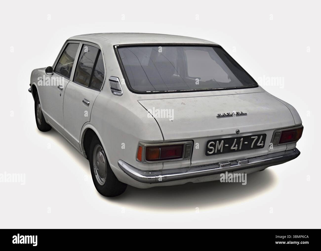 Classic white Toyota Corolla parked on white background, showing rear end Stock Photo