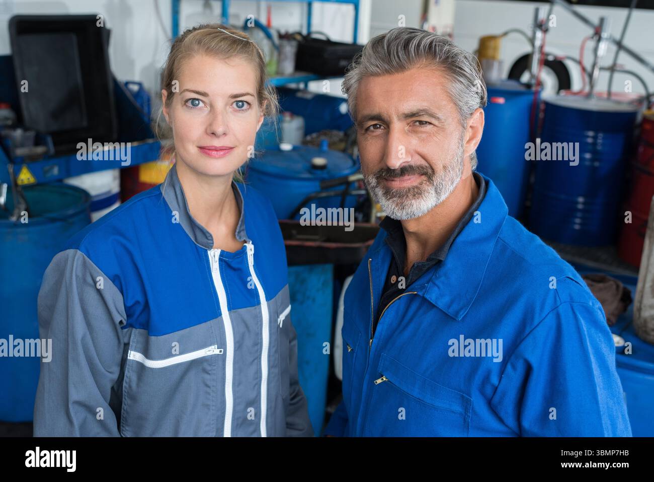 two technicians working in car service Stock Photo