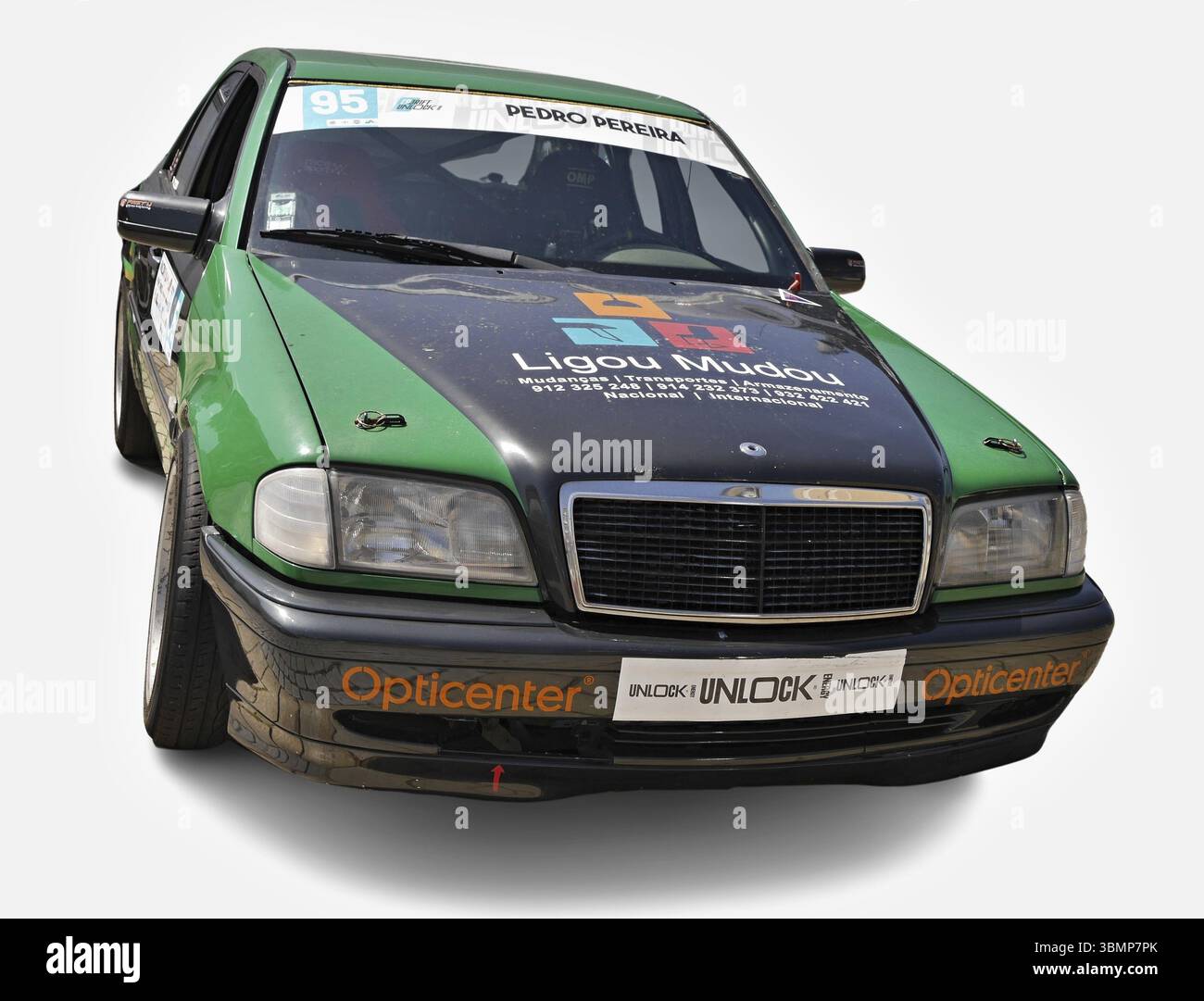 Tuned Mercedes-Benz W202 with racing stickers competing in a rally race ...