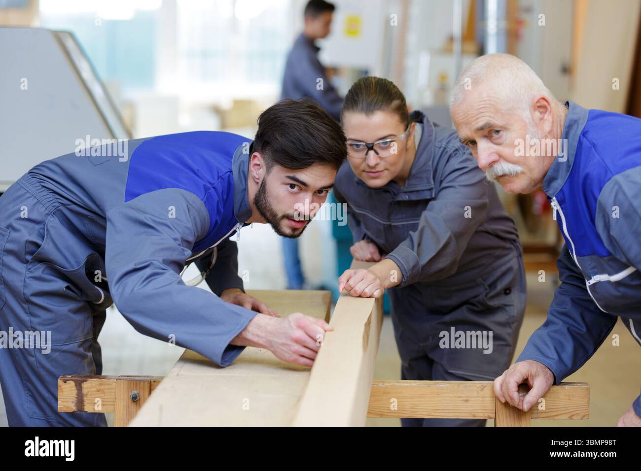 carpenter with apprentice in training period Stock Photo