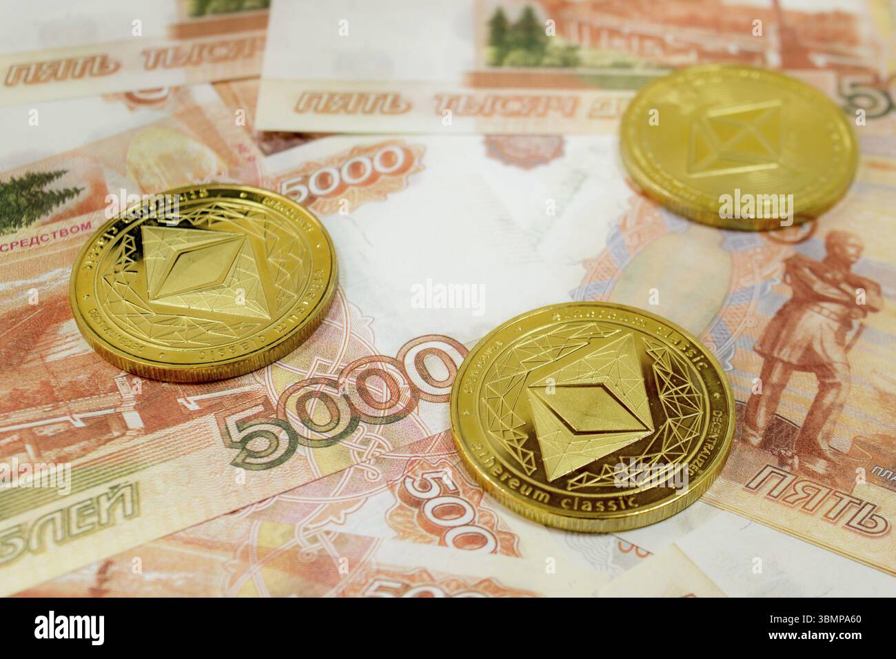 Close-up of Ethereum coins on 100 Euro banknotes. Crypto currency ETC Stock  Photo - Alamy