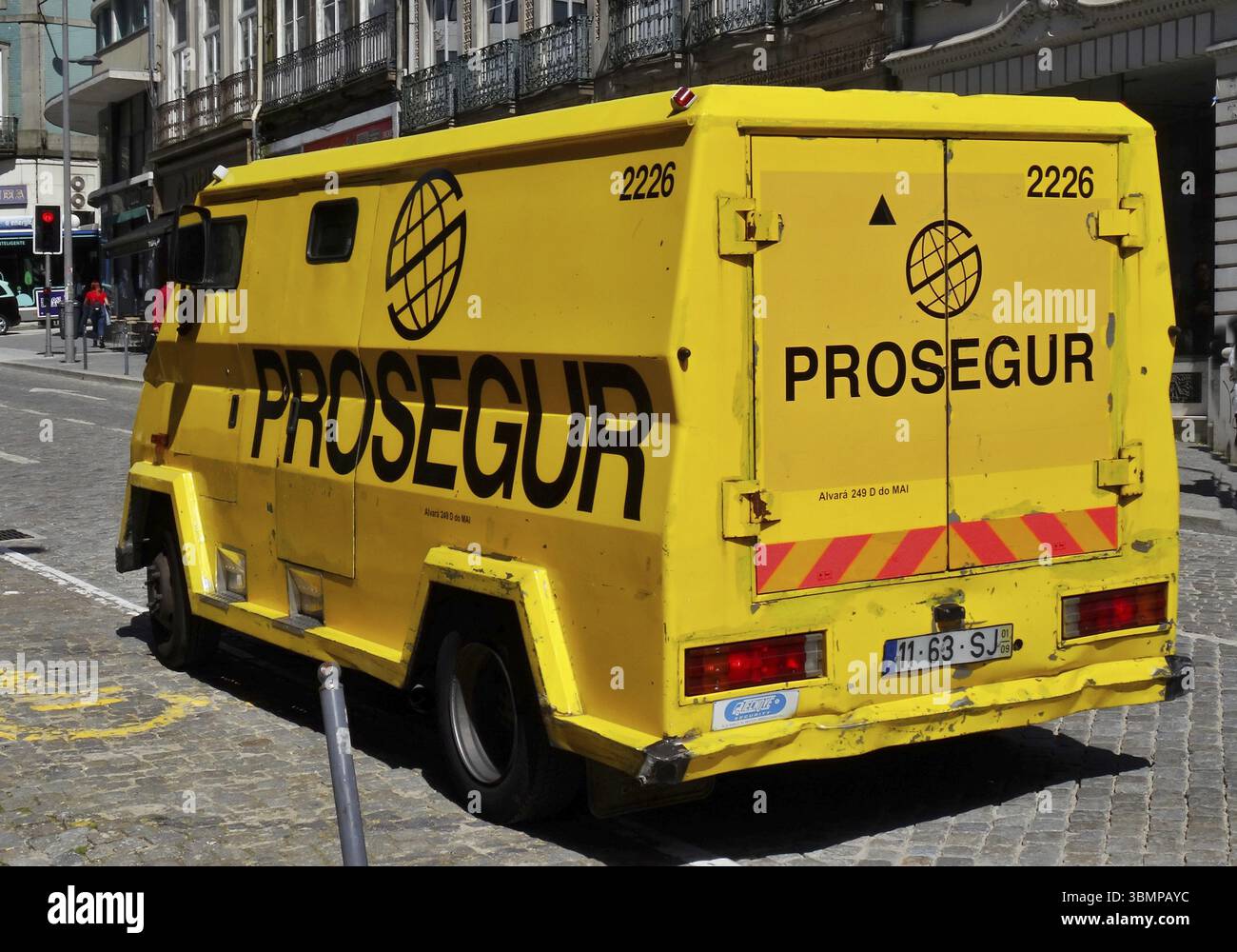 Prosegur Safe Yellow Prosegur security van parked on a cobblestone street in Portugal ...
