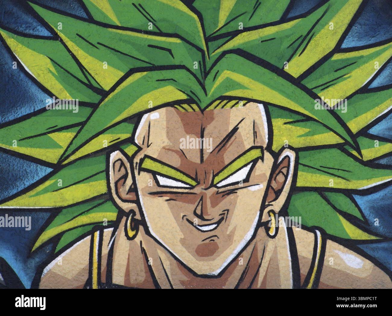 Graffiti art featuring Broly, a character from the popular anime series Dragon Ball Z, showcasing his intense expression and vibrant green hair Stock Photo