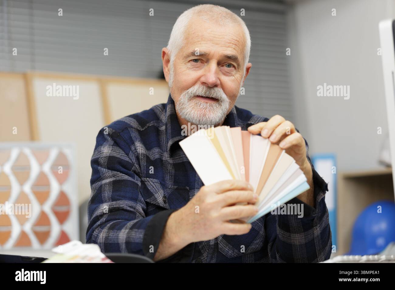 male manager with color swatches in office Stock Photo - Alamy
