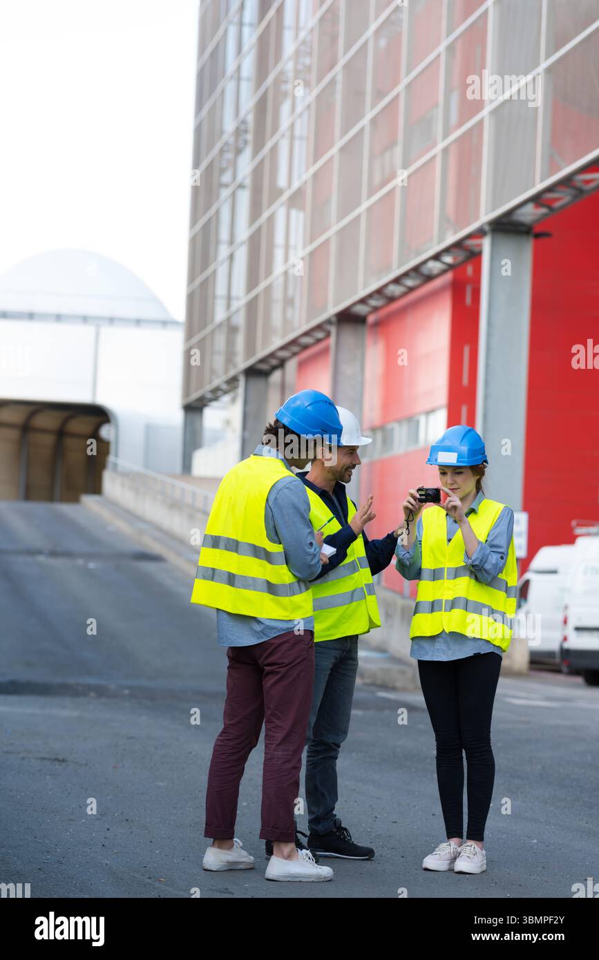 workers talking in shipping yard Stock Photo