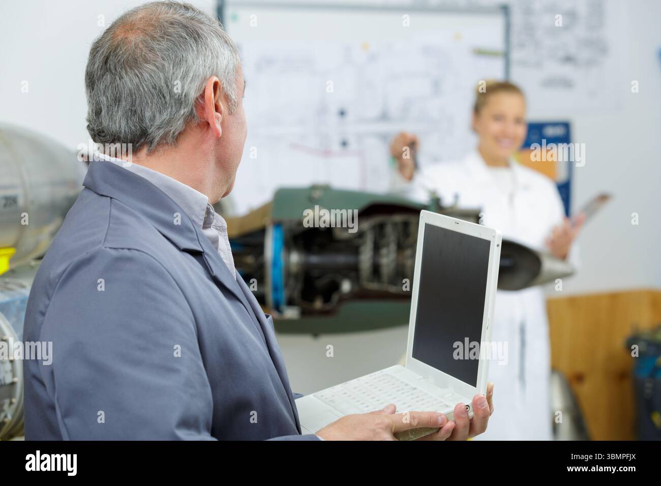 engineer with laptop in design workshop Stock Photo