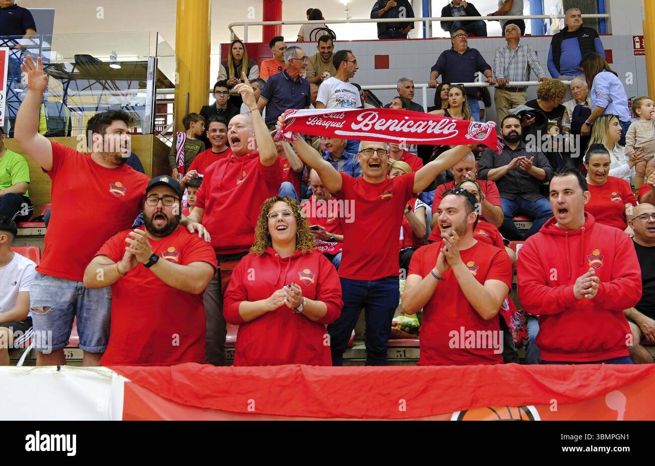 Fans Offering Support Excited basketball fans cheering and clapping in support of their team ...