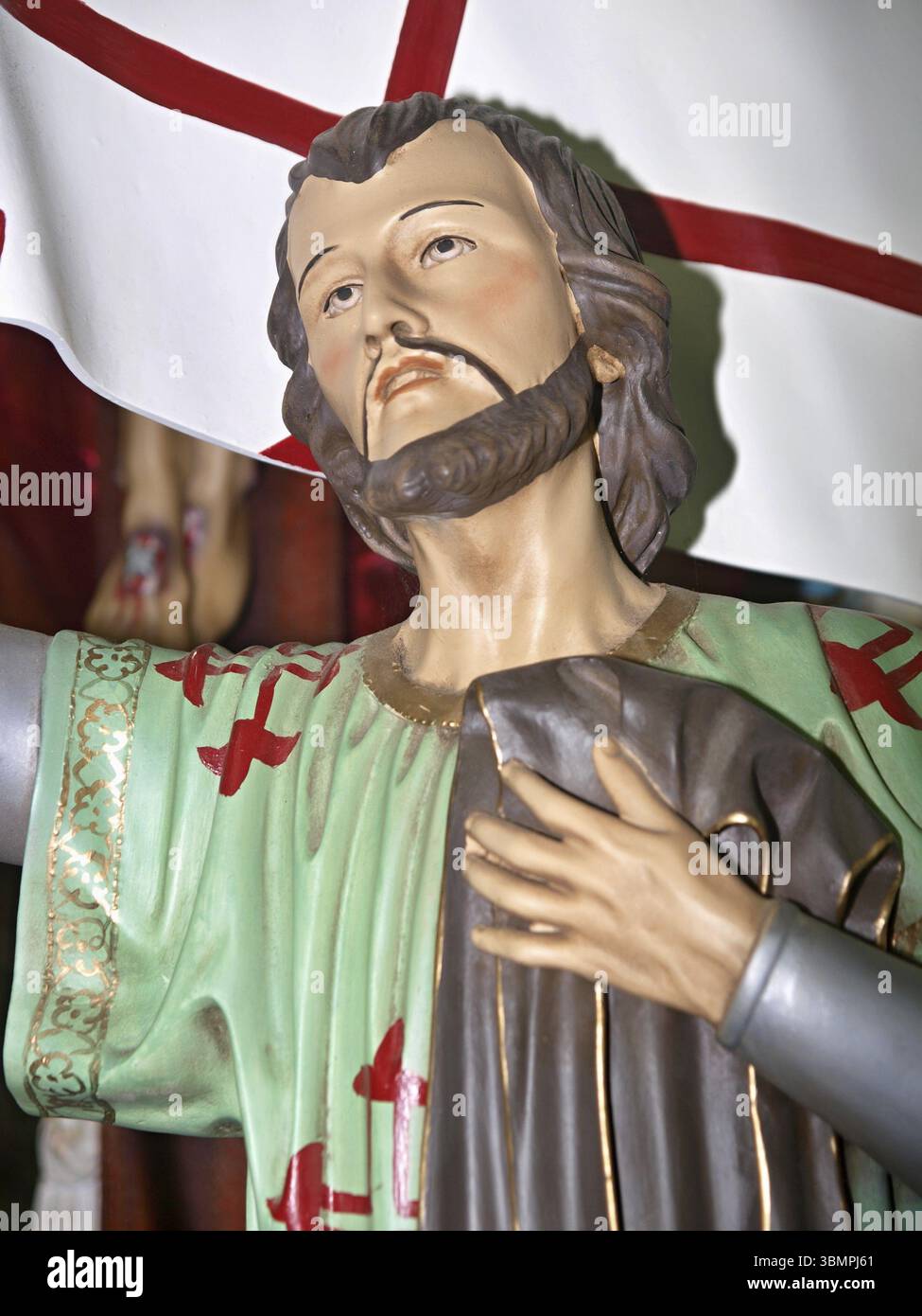 Close-up of a statue of Saint George, identifiable by the white flag ...