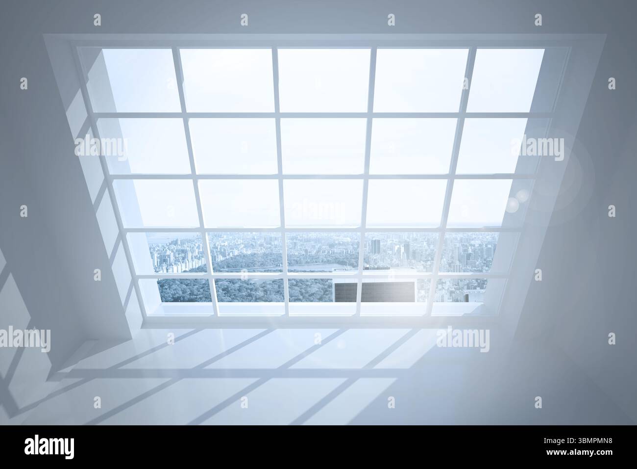 Room with large windows showing city Stock Photo - Alamy