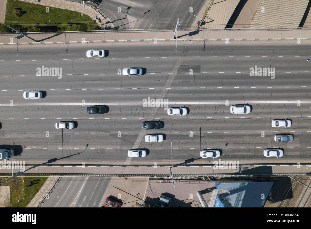 Aerial view of road bridge across river with heavy traffic jam in one ...