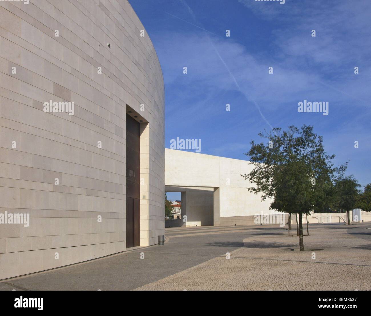 Modern building of Centro Cultural de Belem with trees under blue sky ...