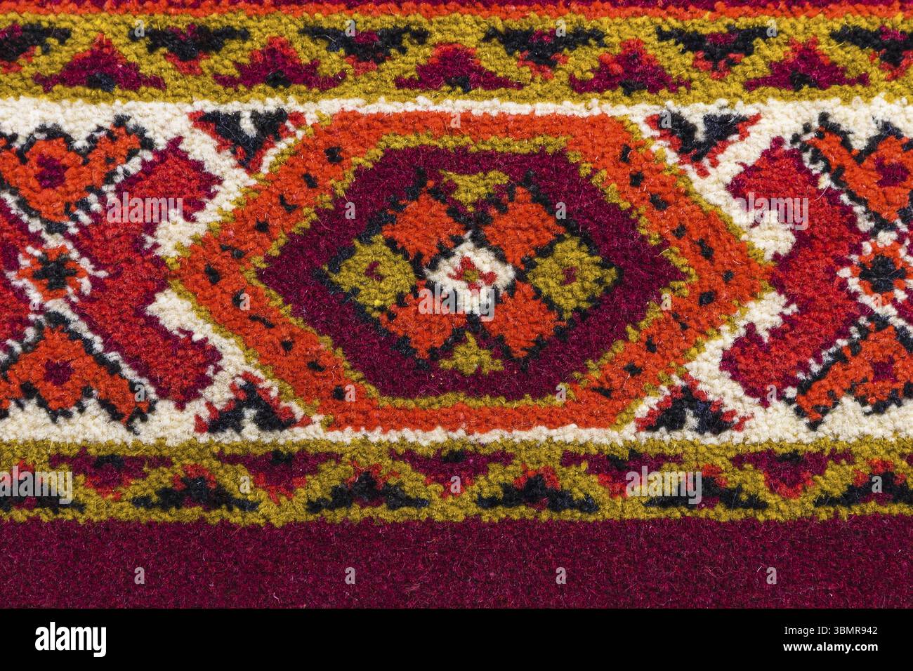 Retro carpet texture with hand-made decorative geometric pattern Stock Photo