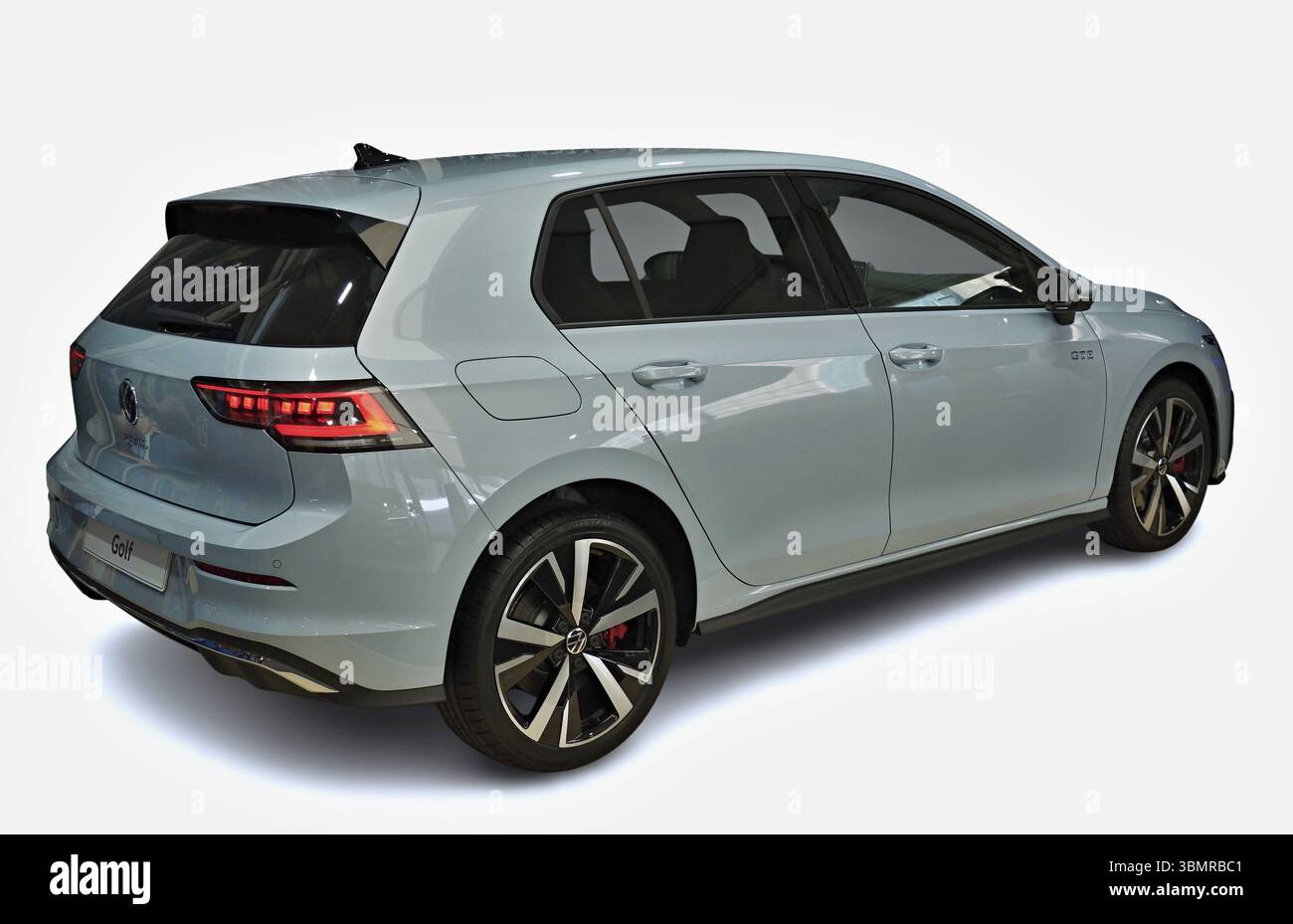 Light blue Volkswagen Golf GTI from the back, highlighting its sporty design and modern features Stock Photo