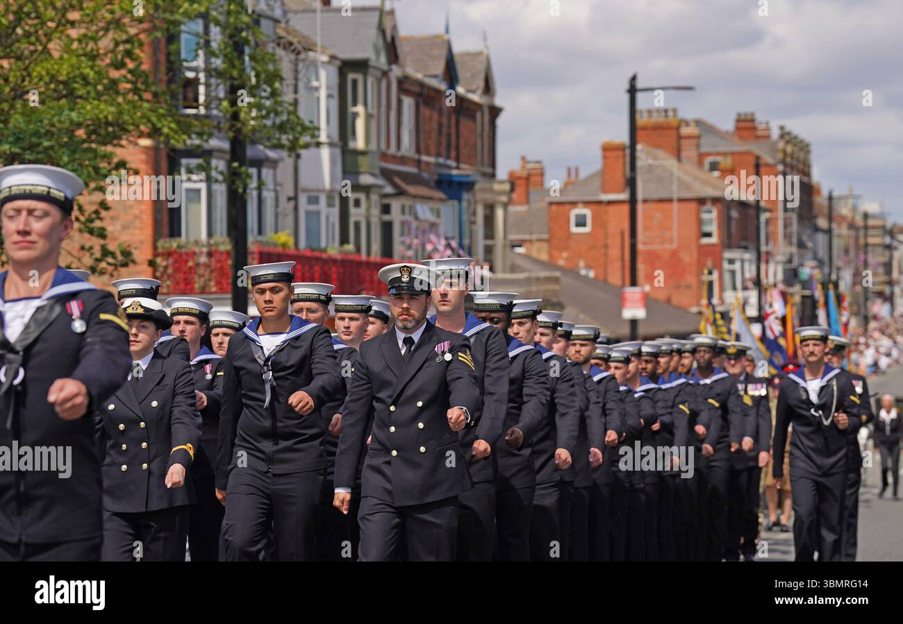 members-of-the-royal-navy-take-part-in-a-parade-druing-armed-forces-day